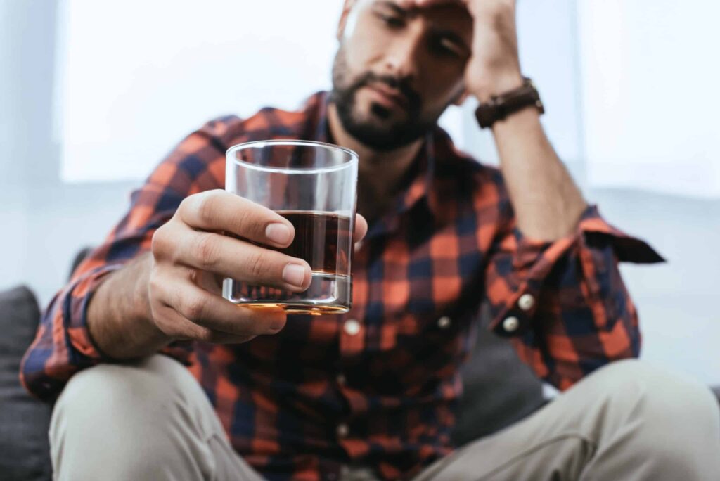 man with alcoholism contemplating alcohol rehab in birmingham