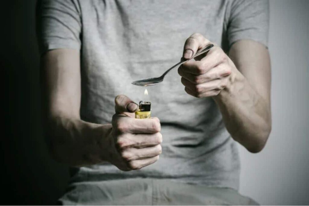 Man using heroin.