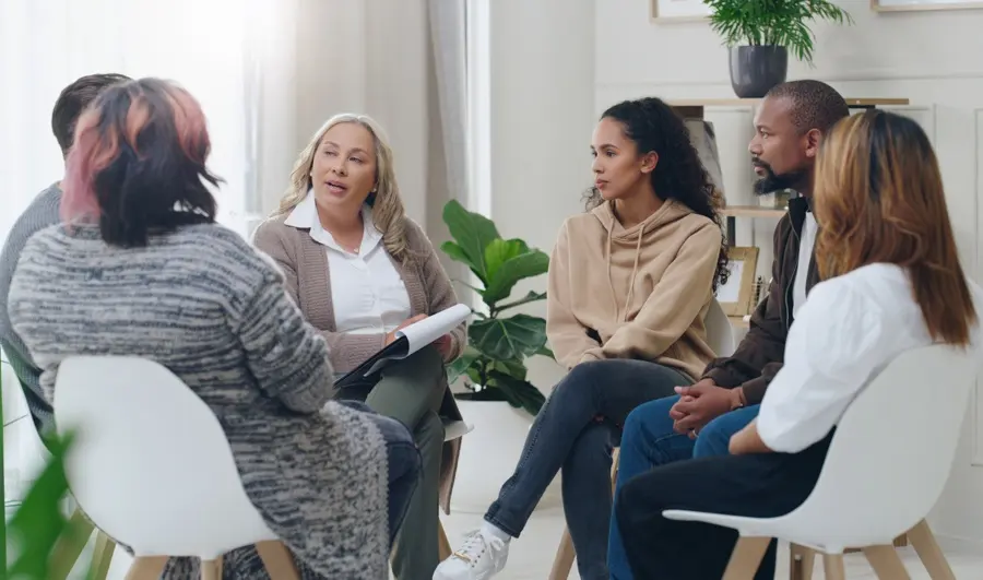 Group therapy exploring aftercare programs for relapse prevention