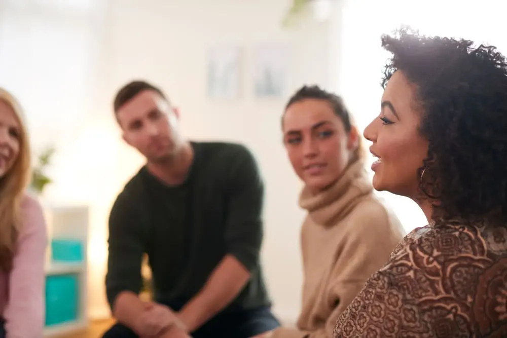 Individuals participating in a substance abuse detox therapy session
