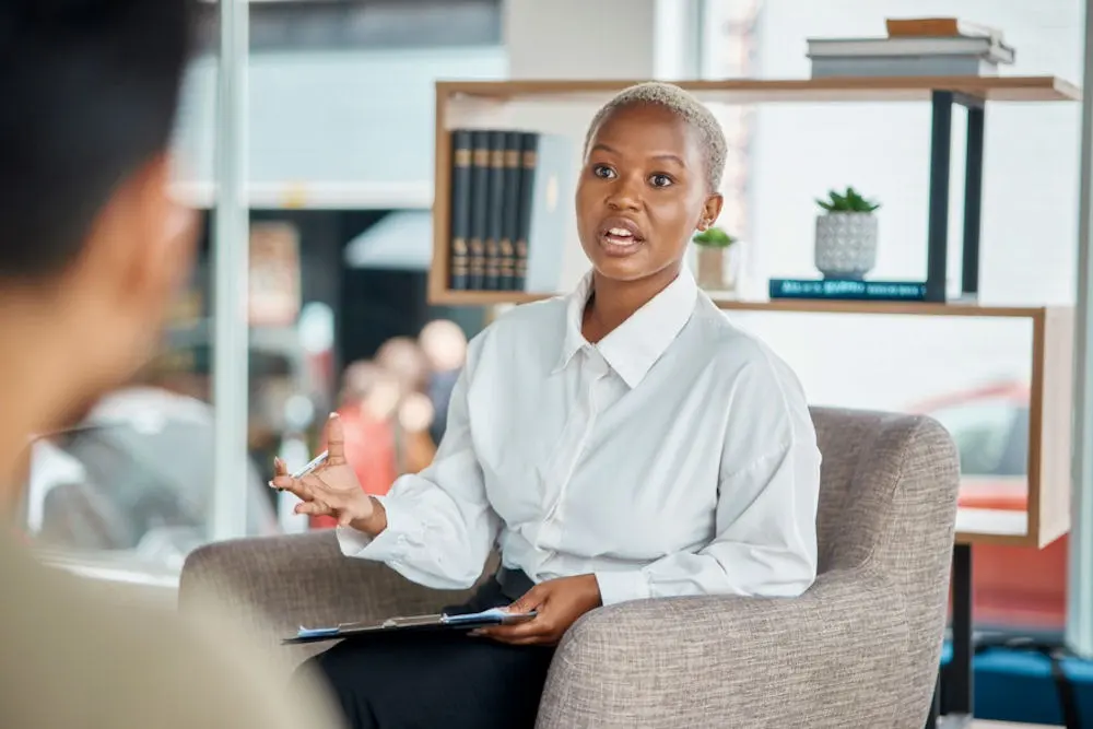 Therapist supporting young man while discussing what are gateway drugs